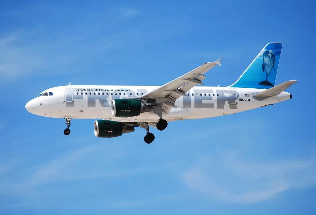 Frontier Airlines plane flies through the air