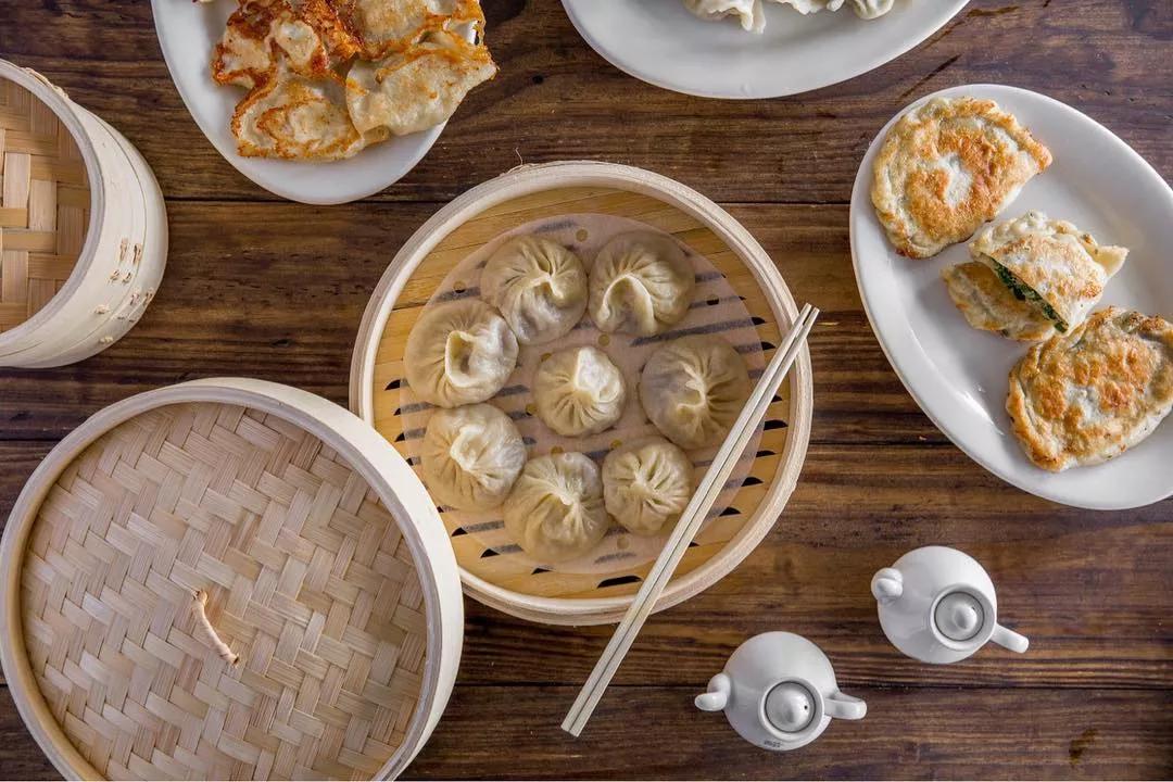 a steam basket with dumplings