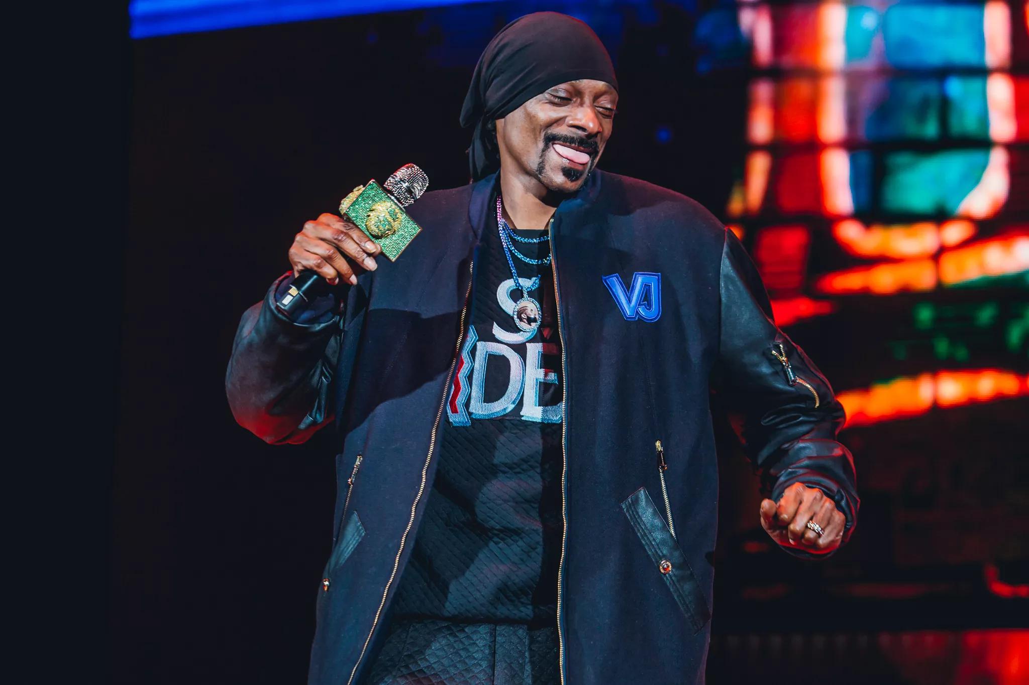 Snoop Dogg laughs on stage during a Colorado concert