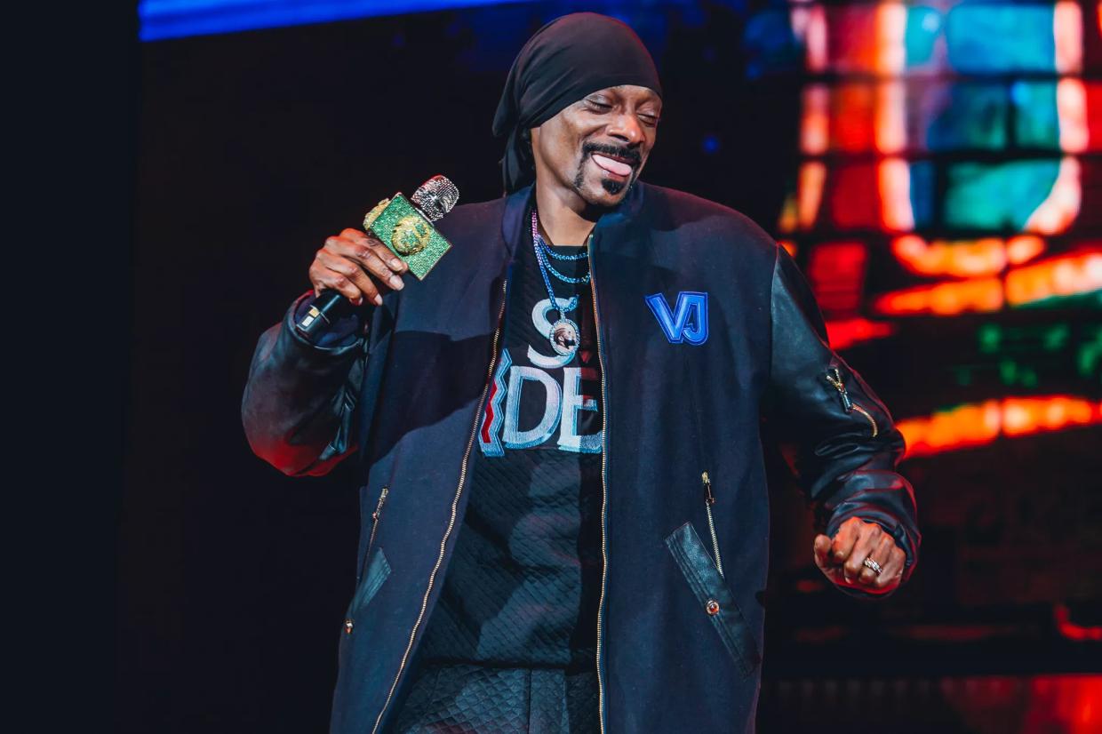 Snoop Dogg laughs on stage during a Colorado concert