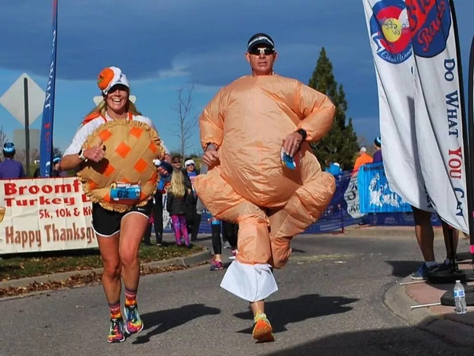 people running in turkey costumes