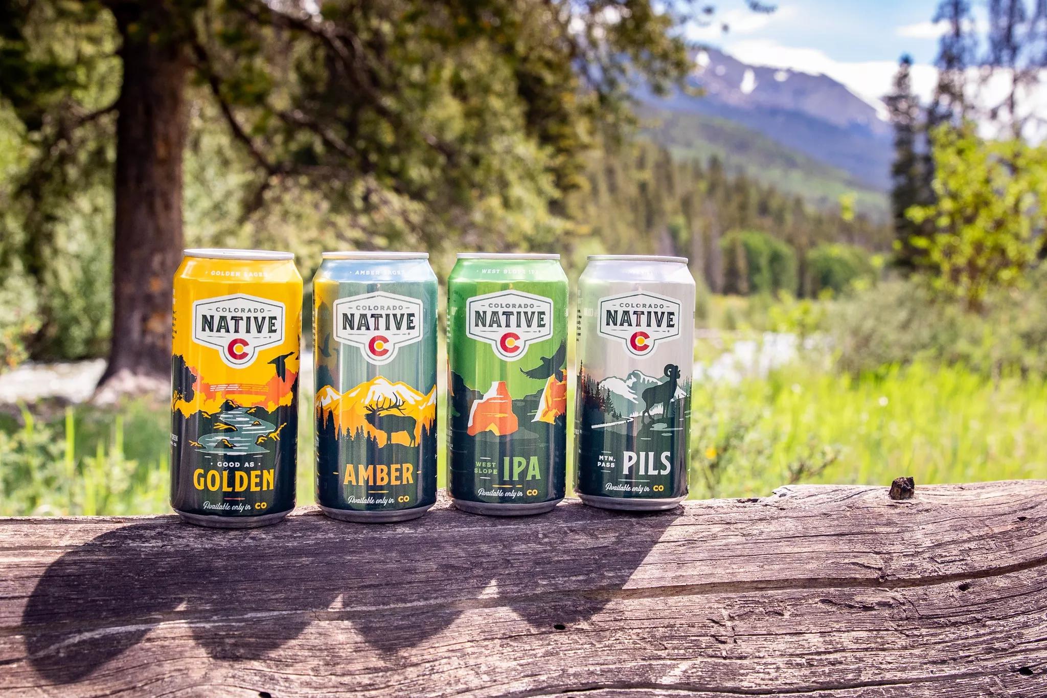four cans of beer line dup outdoors