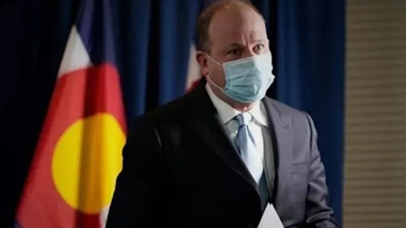 If You Live With COVID Anti-Vaxxers, Get Shots but Don’t Tell Them, Polis Suggests