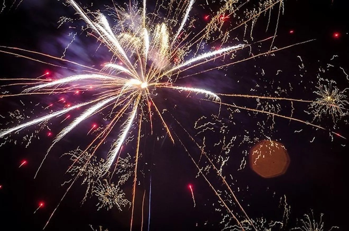 Fireworks explode in the air.