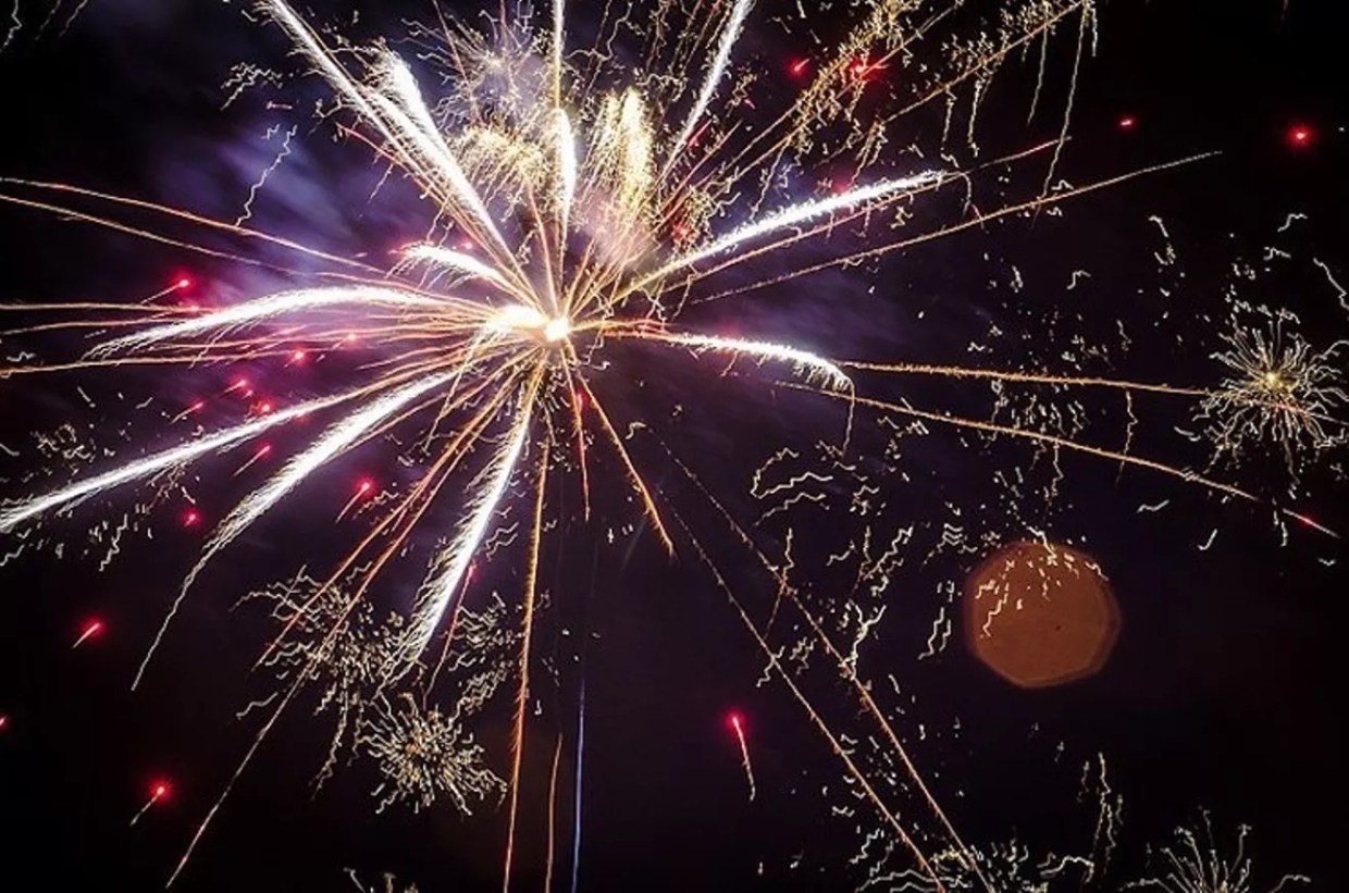 Fireworks explode in the air.