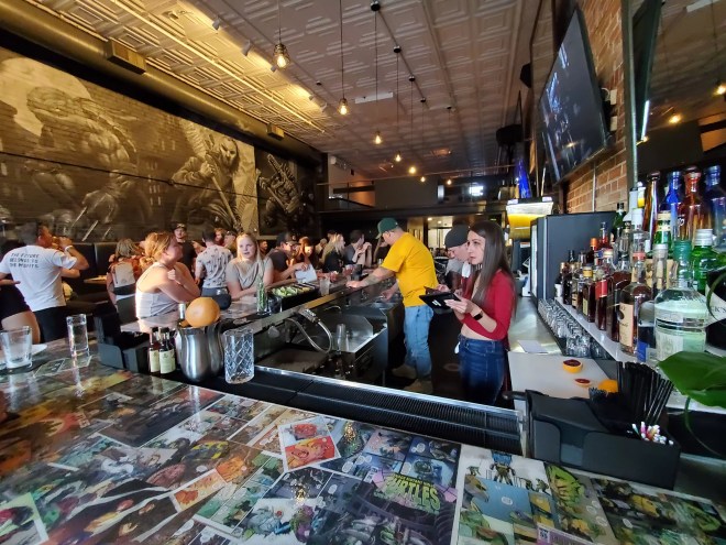 a busy bar filled with customers