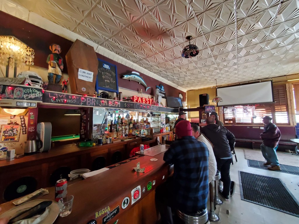 people sitting at a bar