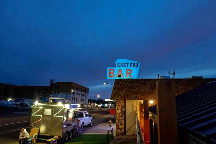 a bar sign on a building