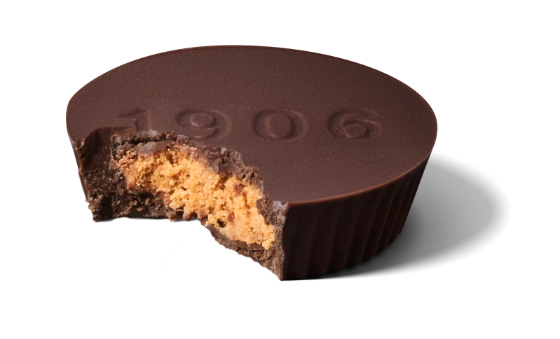 A 1906 chocolate peanut butter cup with a bite taken out