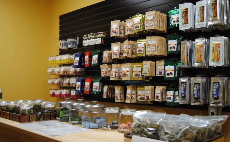 A shelf of cannabis products inside of a dispensary.