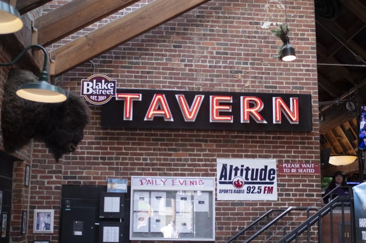 a "Tavern" sign inside a bar