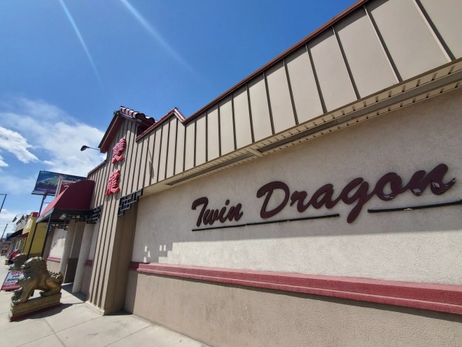 the outside of a building with a sign that says Twin Dragon