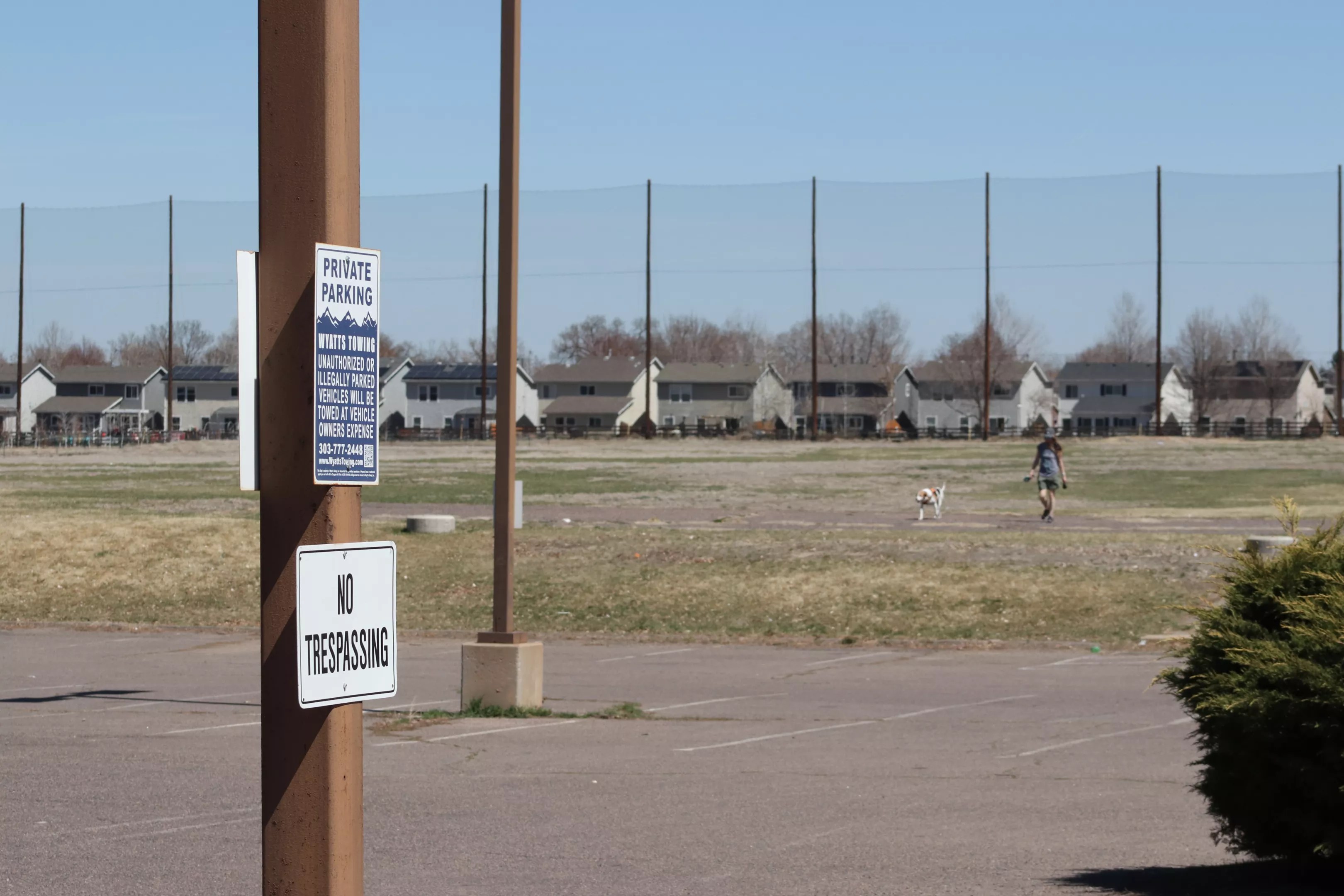 A woman walks in the close Park Hill Golf Course. Many hope the land will become open space.