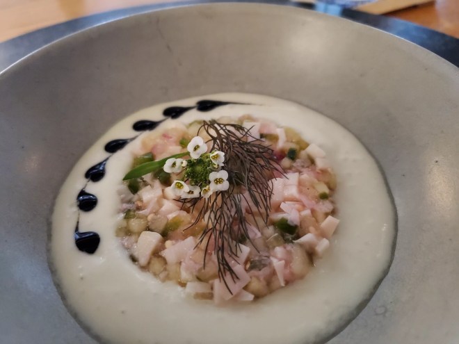 crudo plated on top of white foam