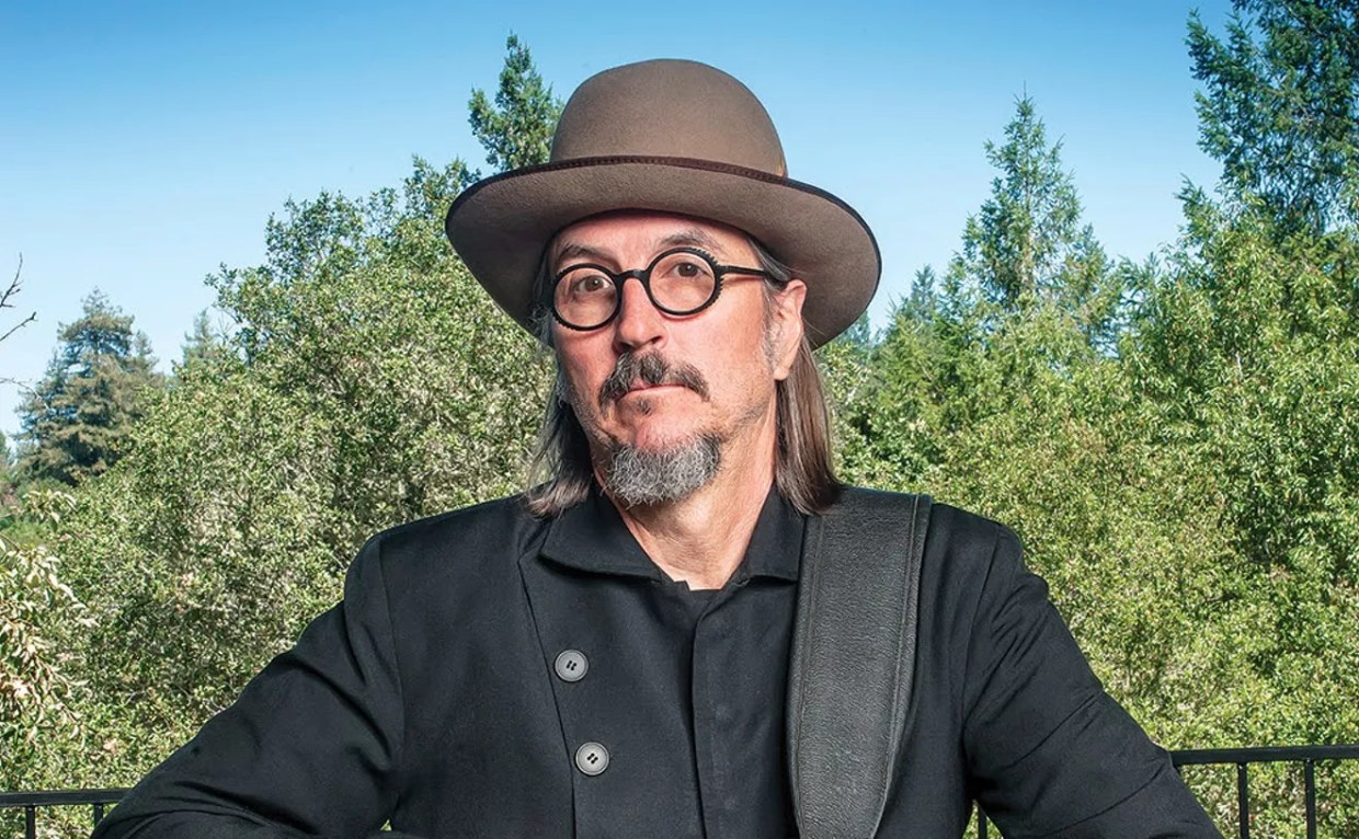 man wearing a hat, glasses and goatee