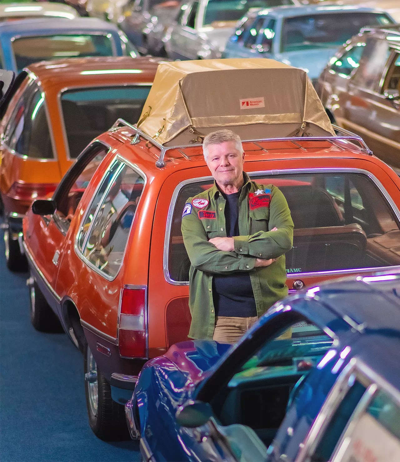 man with AMC car at museum
