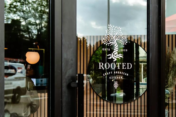tree logo on a glass door