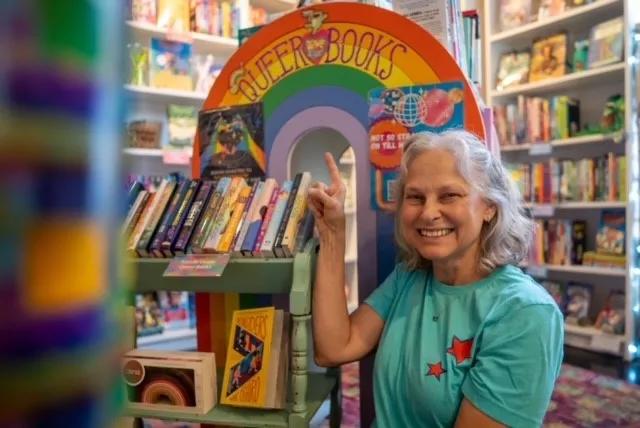 woman smiles in children's book store
