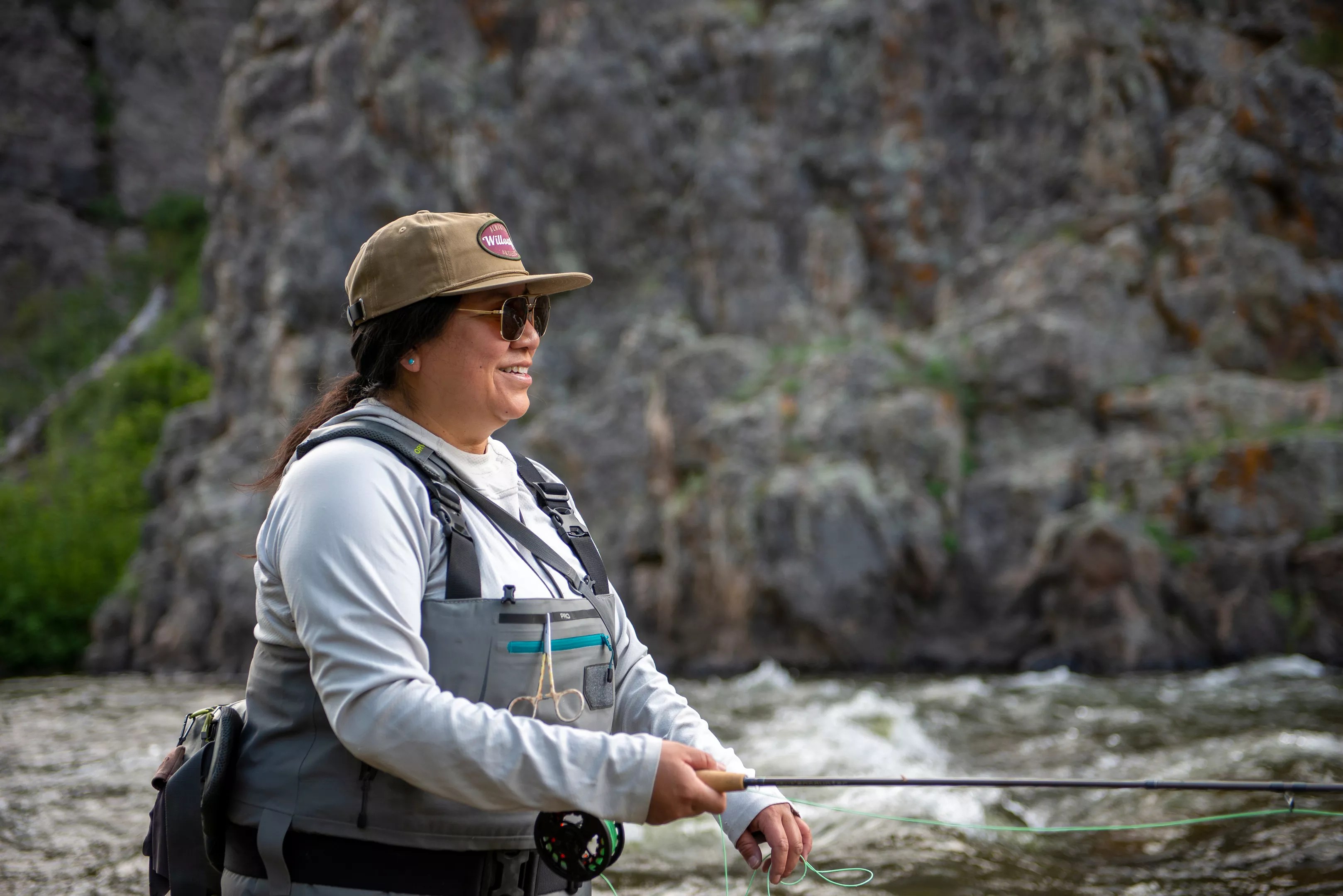 woman fishing in river