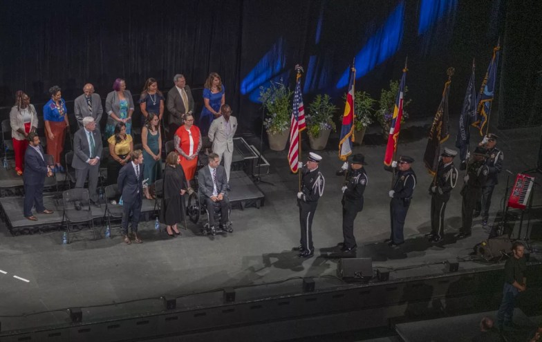 military on stage with flags