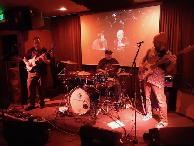 a band plays on a stage