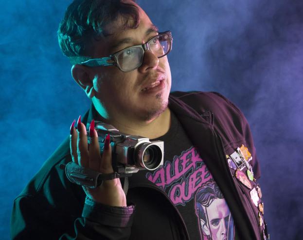 man in glasses with movie camera