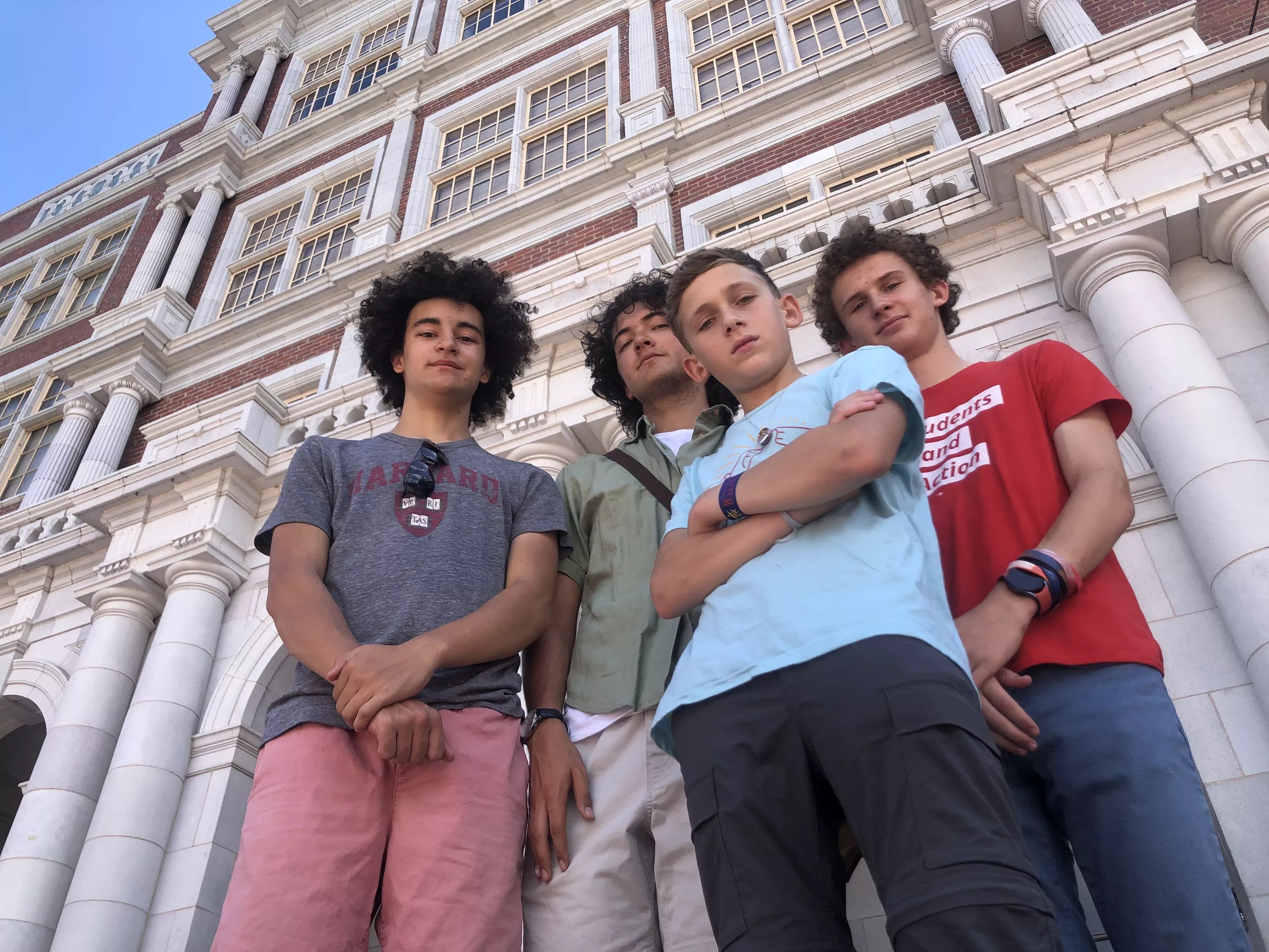 From left: Beckett Nelson-Gardner, Caden Fiala, Seth Shurz and Noah Shurz standing in front of East High School.