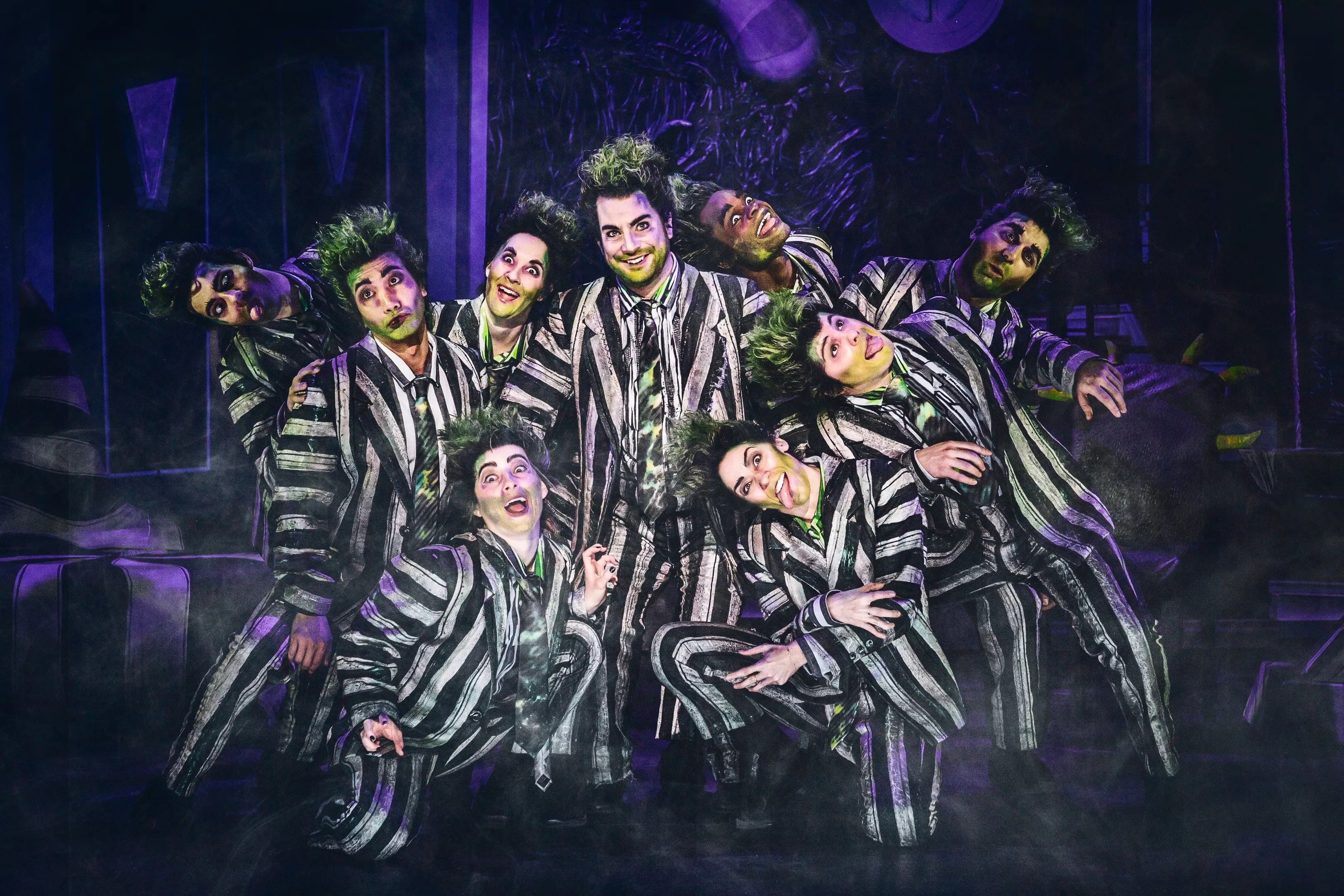 people in black and white striped suits