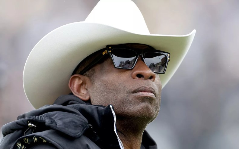 man in cowboy hat and sunglasses