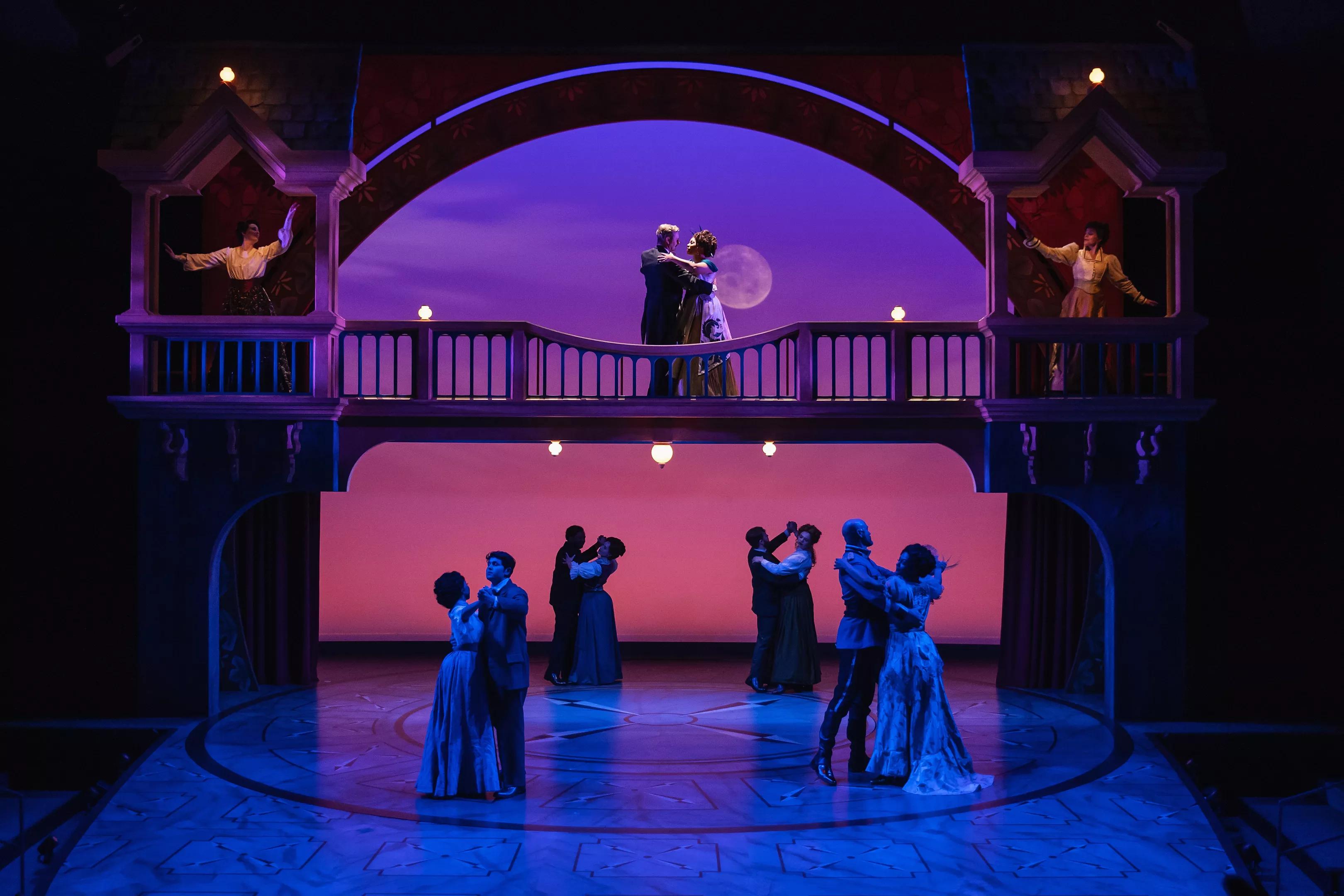 ballroom dancers on theater set at sunset