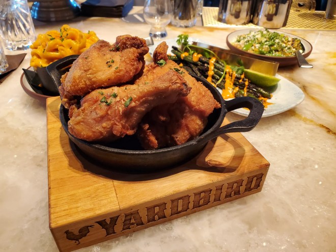 a cast iron skillet filled with fried chicken