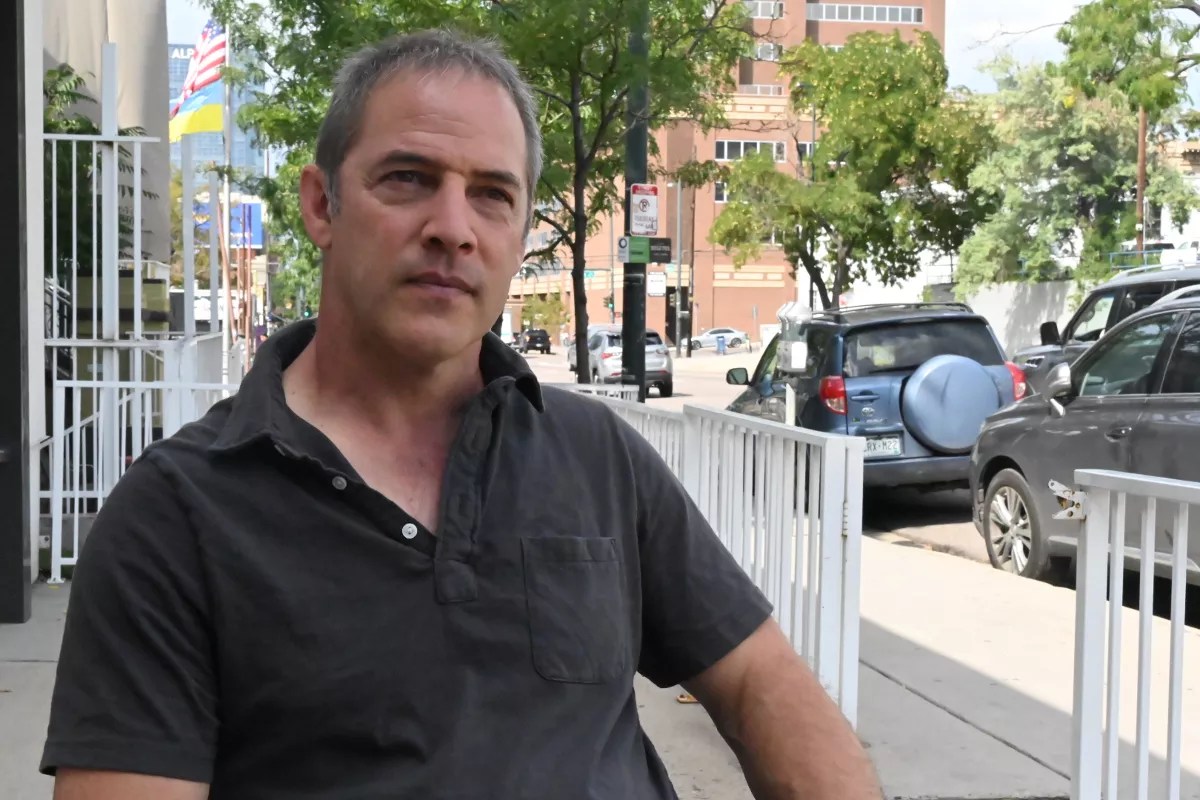 Mark Donovan sits outside.