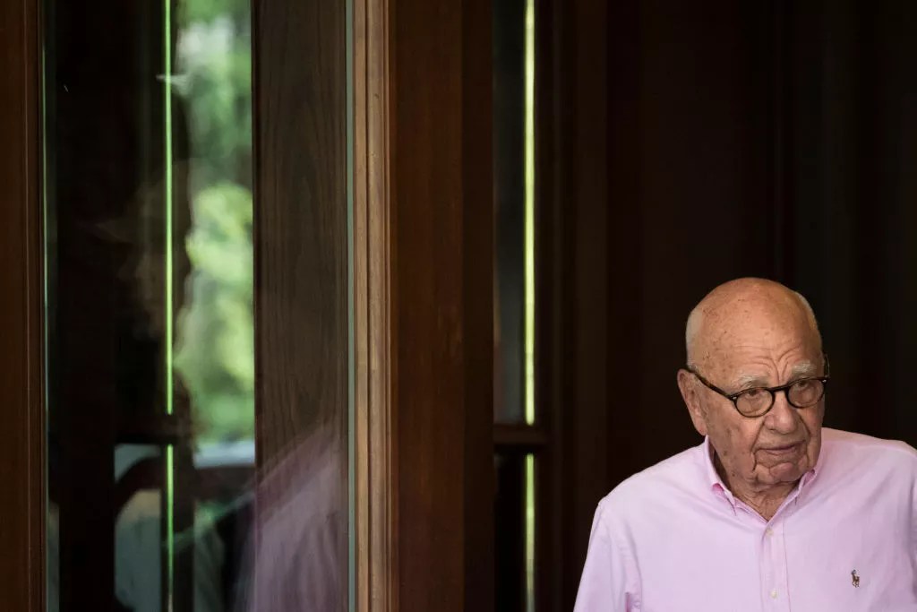 elderly man in pink shirt
