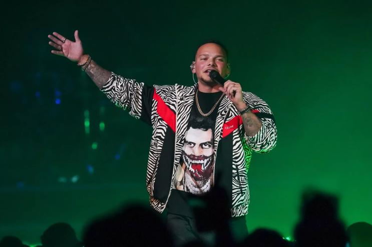 man rapping into microphone