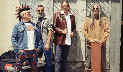 a man with a mohawk, man with a beard, man with leather jacket, and man with long gray hair