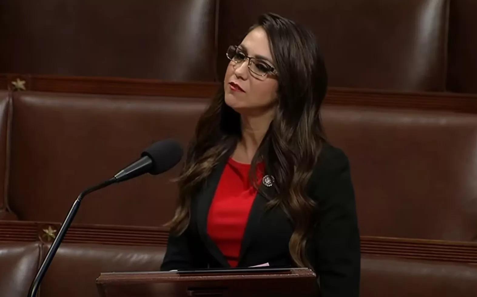 woman in red shirt in Congress