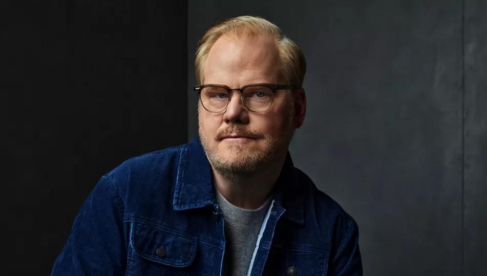 man posing in a denim shirt