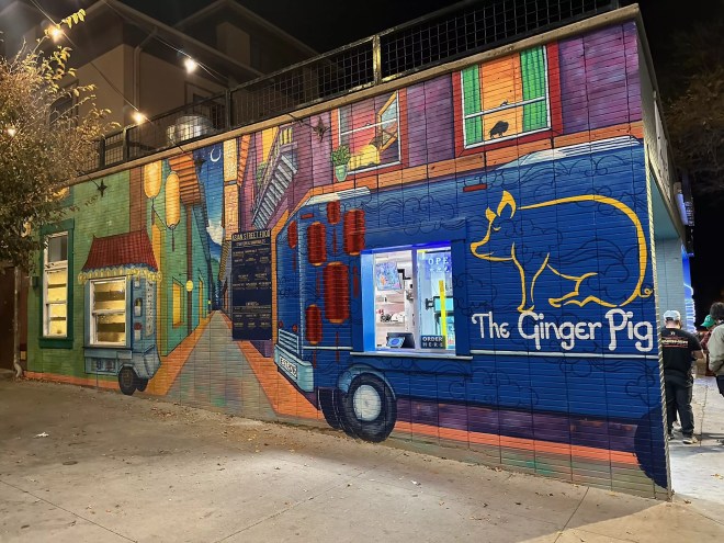 a food truck mural on the outside of a building