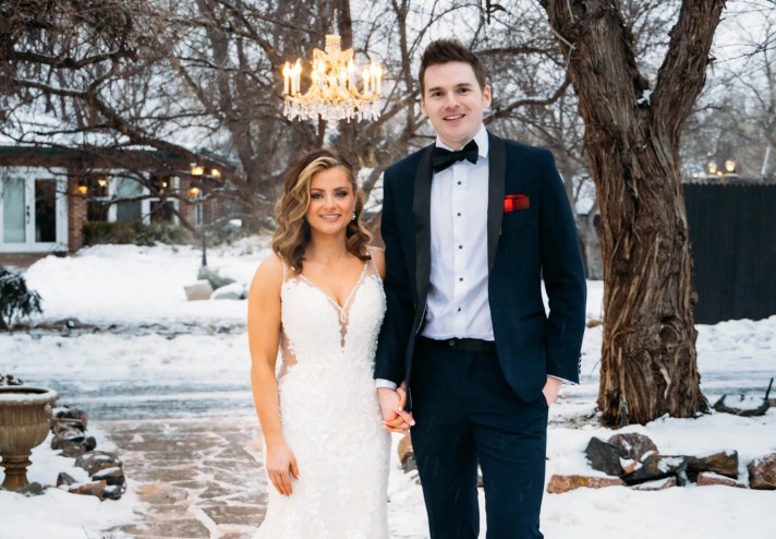 Clare and Cameron pose for a wedding portrait.