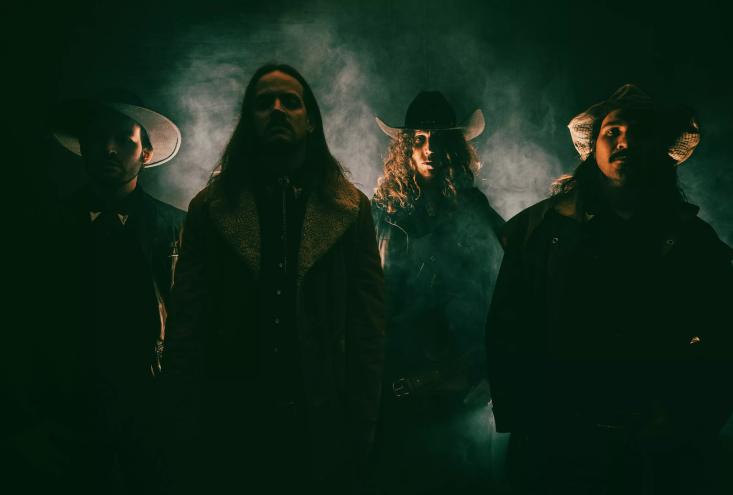 band members wearing western wear for a photo shoot