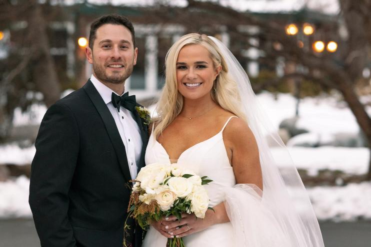 Emily and Brennan pose for a wedding portrait.