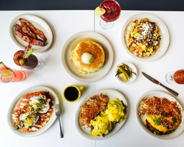various food on plates on a white table