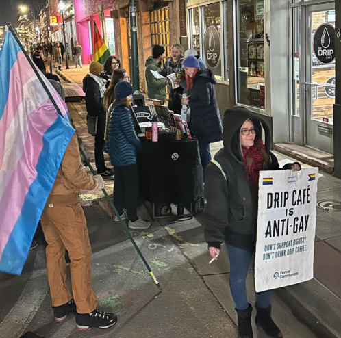 Protesters with Denver Communists and within the LGBTQ+ community hold a demonstration at the Drip Cafe in Denver, Colorado.