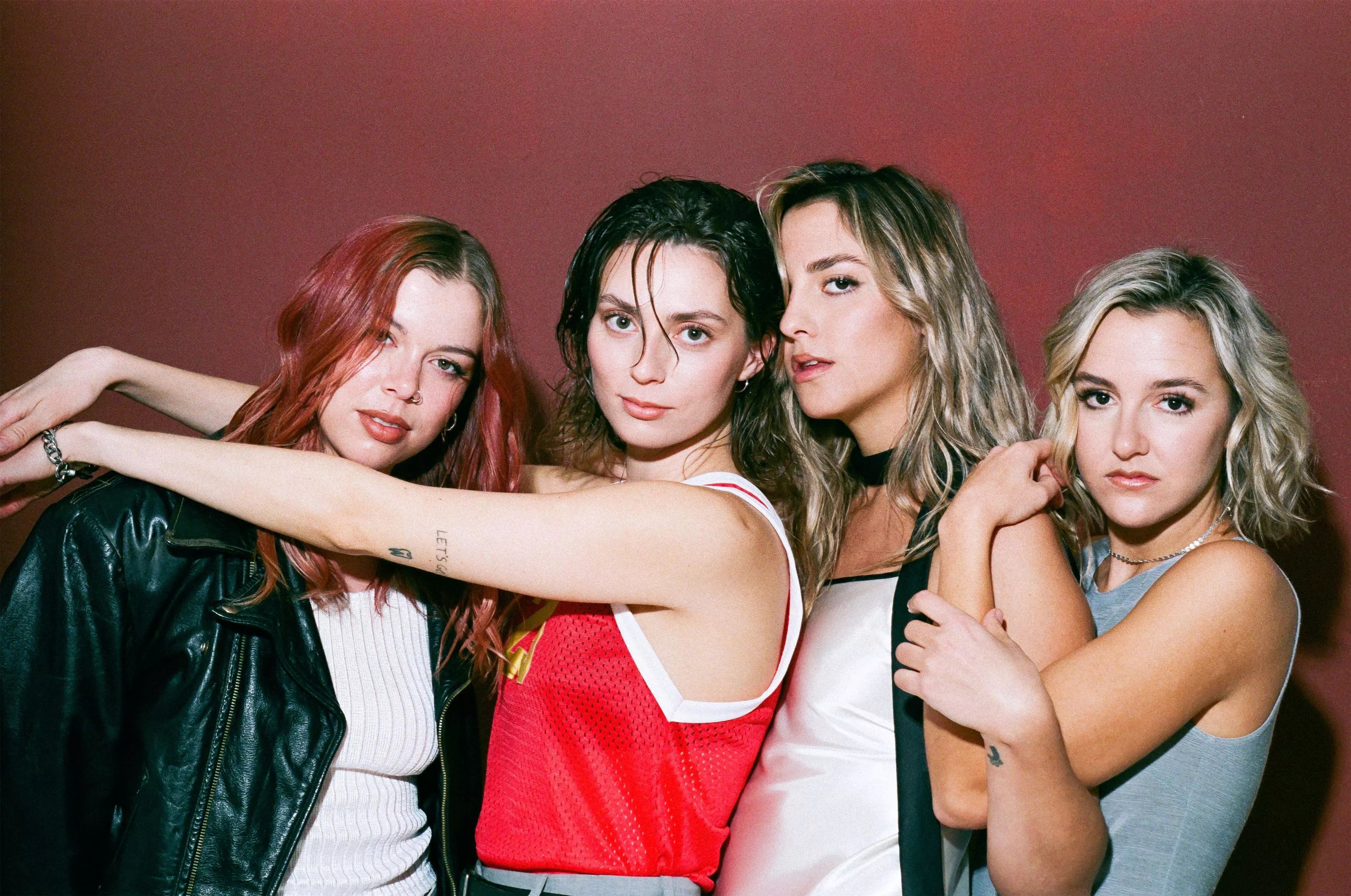 four women pose for a photo