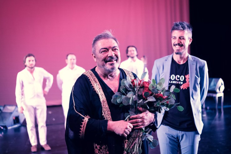 man holding flowers