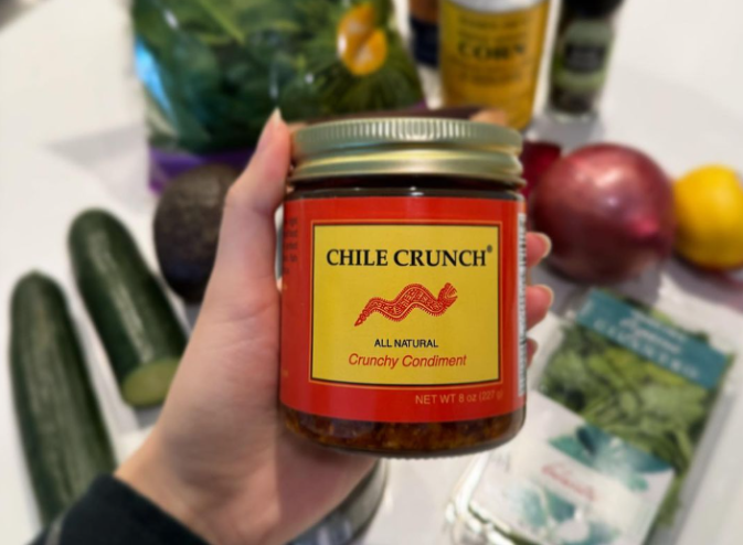 hand holding a jar of Chile Crunch