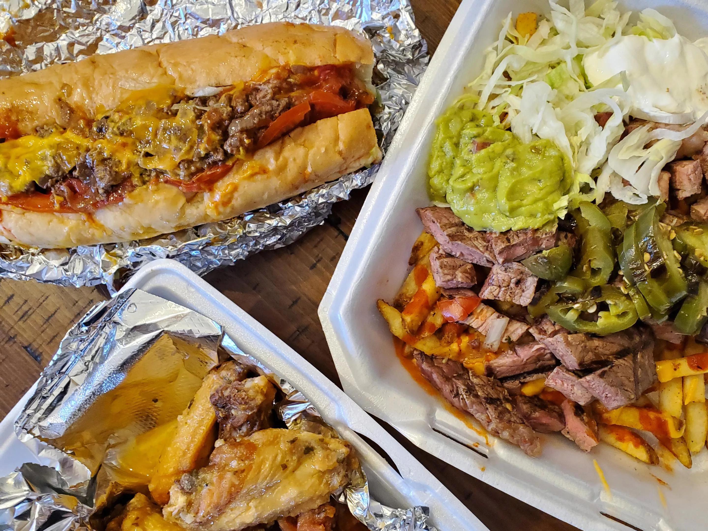 wings, loaded nachos and a chopped cheese sandwich
