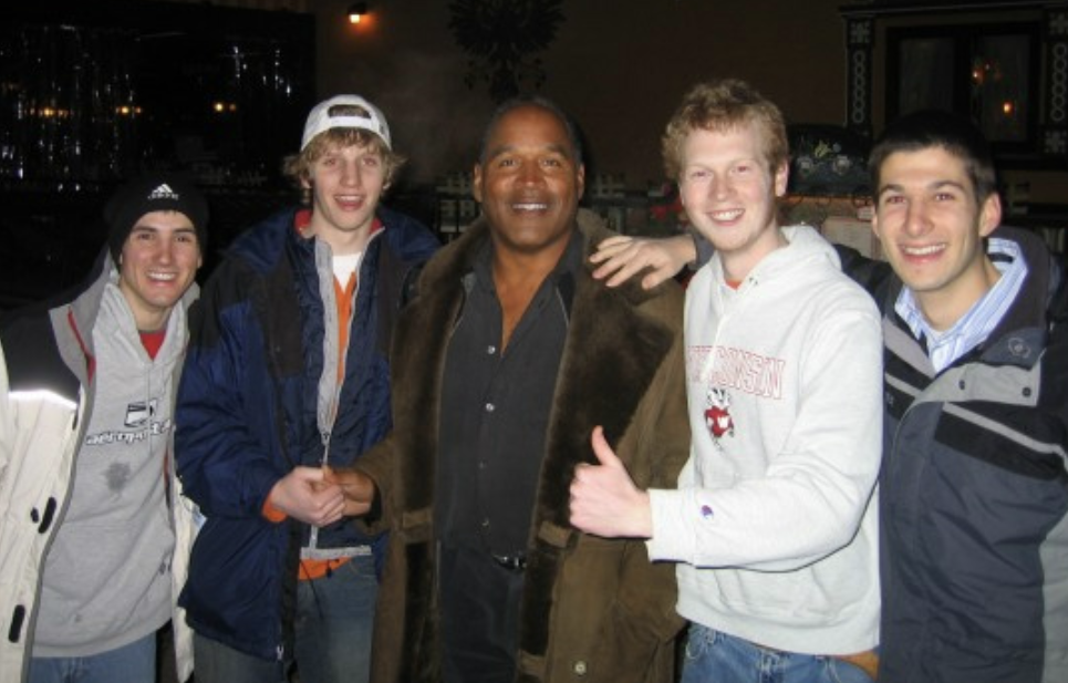 O.J. Simpson posing with fans.