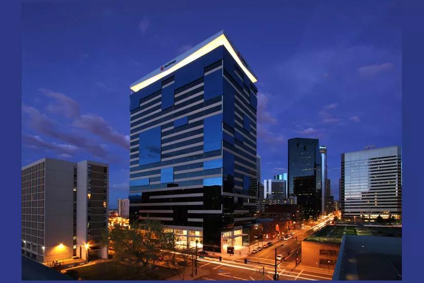 downtown Denver tower in dark.
