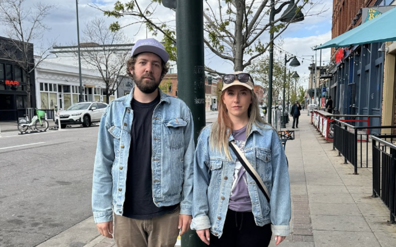 a man and a woman in jean jackets